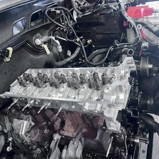 Engine cylinder head exposed during mechanical repair